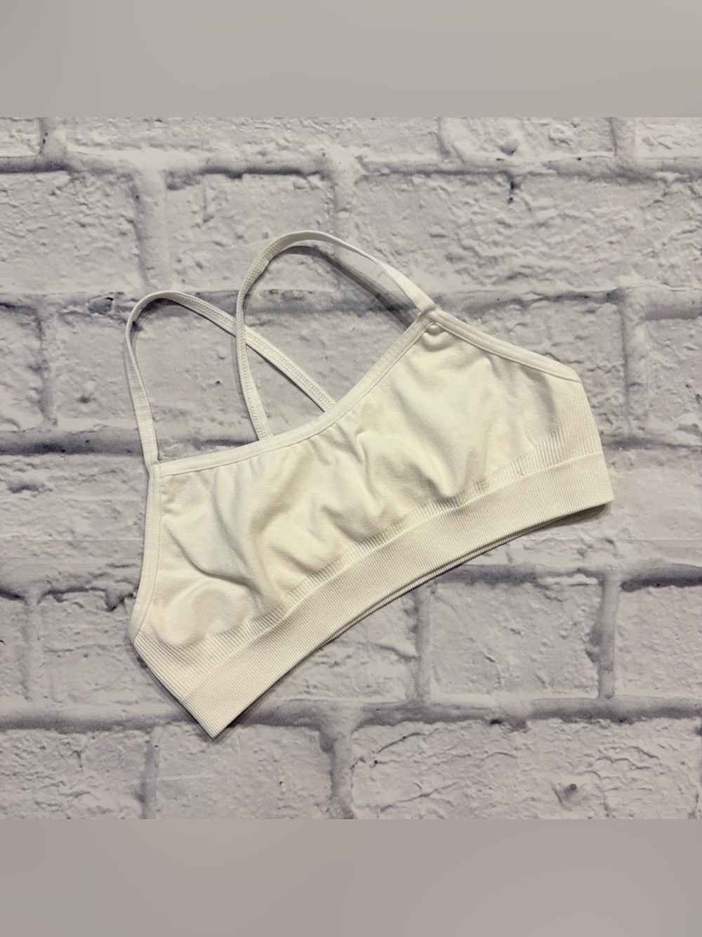 Athleta Girl white light-impact sports bra (small/7 youth)